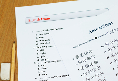english exam on wooden tableの写真素材