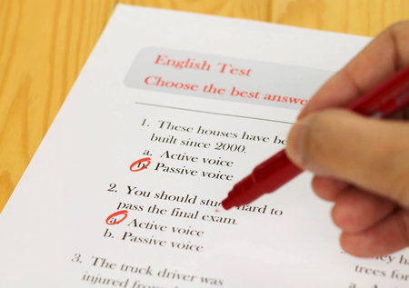 English test with red pen on deskの写真素材