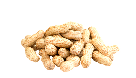 isolated pile of raw peanuts on white background