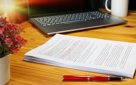 proofreading paper on table in office for serviceの写真素材