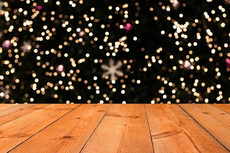 perspective wooden board over blurry bokeh starry lights 