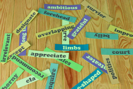 English vocabulary cards on wooden table for studying