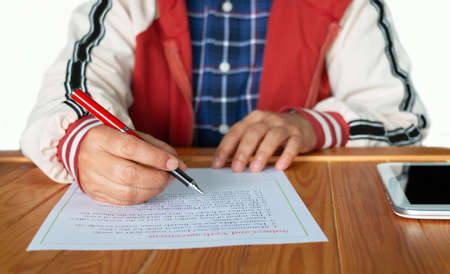 Subject and Verb Agreement worksheet on wooden table in class