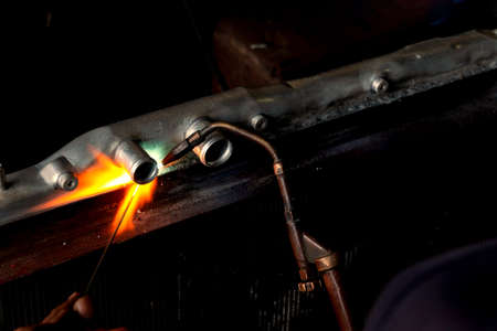 flame of welding steel spark in the dark by technicianの写真素材