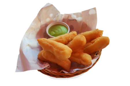 isolated fresh deep fried traditional Thai doughnut stick on white