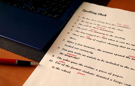 spelling check paperwork with red mark error correctionの写真素材