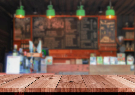 perspective brown wooden board over blurred coffee shop counter