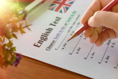 English grammar test on wooden table in classroomの写真素材