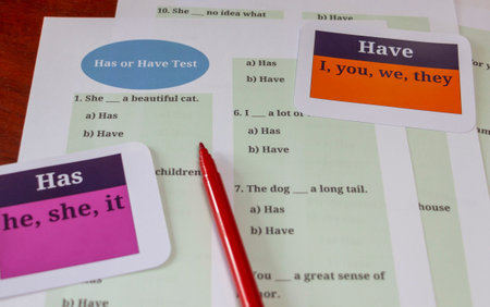 colorful English grammar test sheet on table in classroomの写真素材