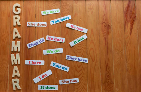English cards of grammar on wooden plate for studying conceptの写真素材
