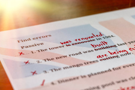 English test with red correction words in classroom under summer lightの写真素材