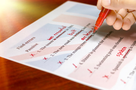 English test with red correction words in classroom under summer lightの写真素材