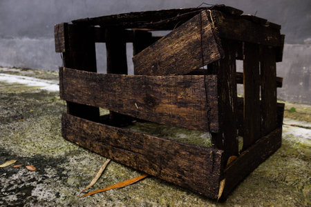 Rusty old wet broken black box pallet on outdoor shoot from corner sideの写真素材