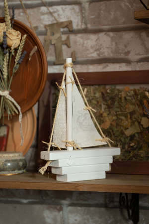 White ship made of wood with your own hands in vintage styleの写真素材