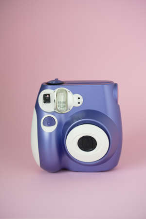 Purple instant camera on pink backgroundの写真素材