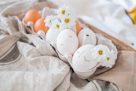 monochrome easter eggs with faces top view. Easter holiday concept 