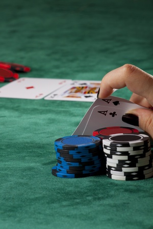 Lady with black manicure holding a great poker hand.のeditorial素材