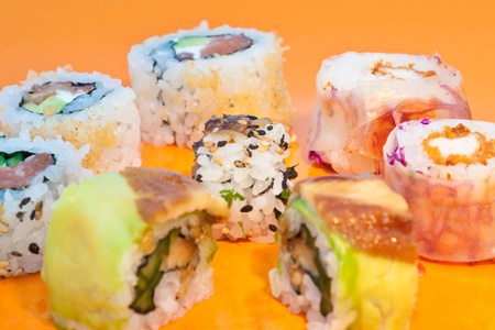 Close up of sushi in an orange plate, horizontalの写真素材