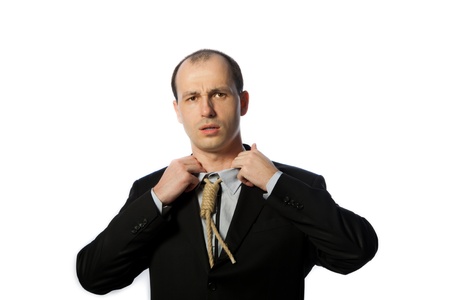 Businessman with gallow tie suffocating and trying to have a breath, horizontal shot, isolated on whiteの写真素材
