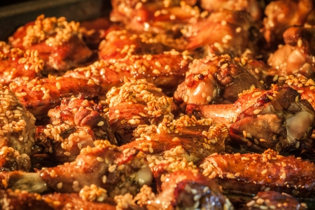 Chicken wings with sesame seeds in the ovenの写真素材
