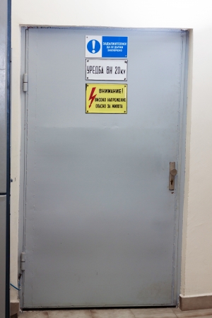 Industrial door with high voltage warning signの写真素材