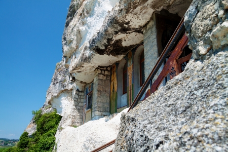 Orthodox monastery excavated in the rocks view from belowの写真素材