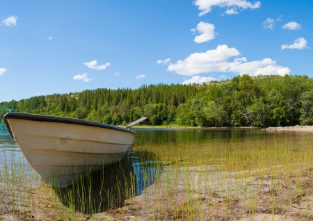 A boat and lake in Northern Norwayの写真素材