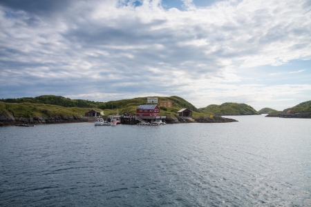 Houses and small harbor on island in Northern Norwayの写真素材