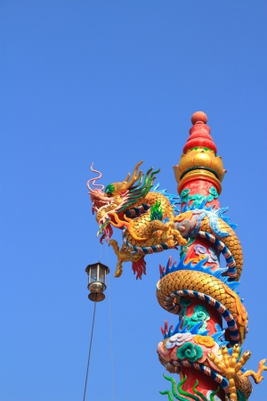 dragon statue climb the pole の写真素材