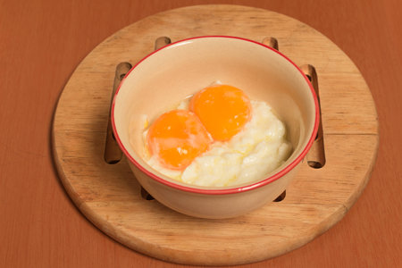 soft boiled egg on the brown tableの写真素材