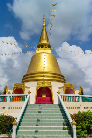 Gold pagoda with tree and sky backgroundの写真素材