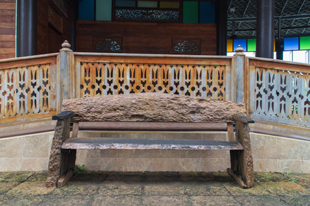 old wood chair with retro house backgroundの写真素材