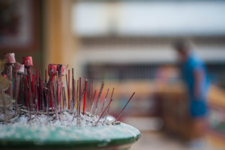Incense sticks burning in the Buddhist temple, close-up.の写真素材