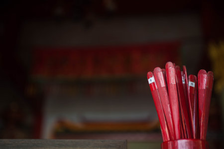 Red incense sticks in the Chinese temple, close up shot.