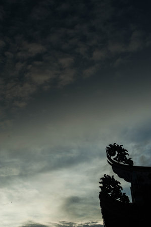Silhouette of a stupa in the sky with clouds