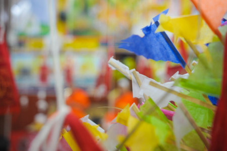 Colorful paper garland in Buddhist temple, closeup of photo