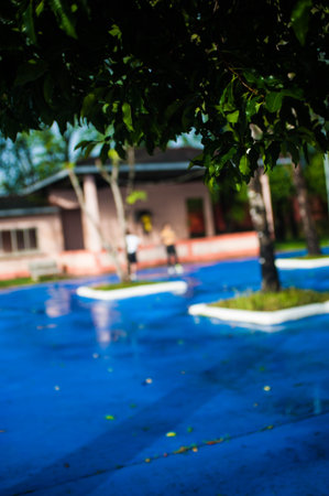 Blur image of outdoor swimming pool in tropical garden, Thailand.の写真素材