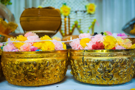 Thai style gold bowl for worship in Thai temple, Thailand.