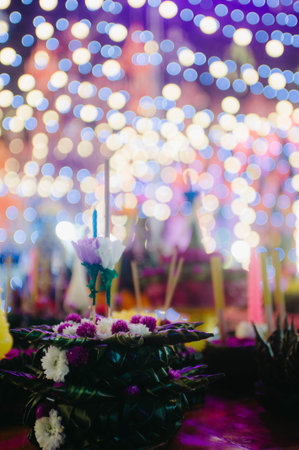 Candles in the form of a flower on the background of the bokehの写真素材