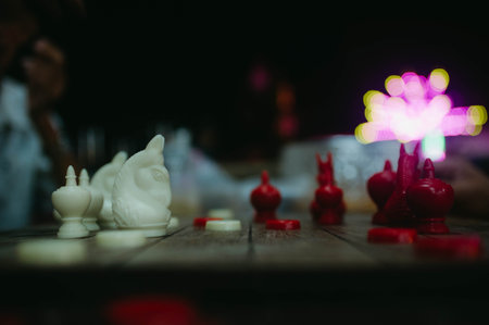 Chess pieces on a wooden board with a blurred background. Selective focus.の写真素材