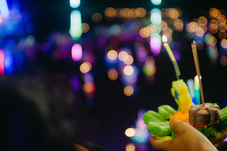 Close up of food in hand with blurred bokeh backgroundの写真素材