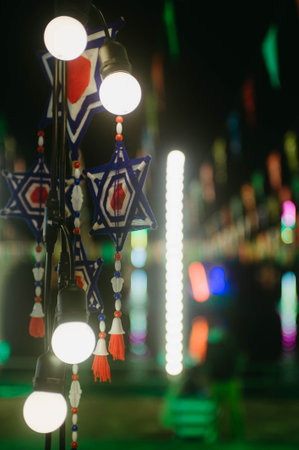 Hanging star with bokeh background, christmas decoration.の写真素材