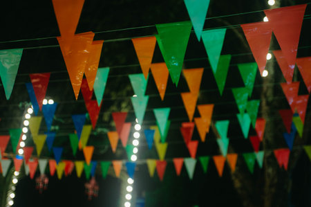Colorful garland of flags on the street in the evening.の写真素材