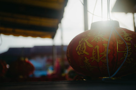 Chinese New Year decoration with red paper lanterns and blurred background.の写真素材