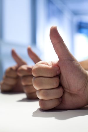 three man having their thumbs upの写真素材