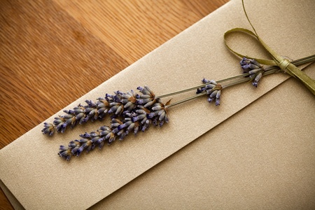 Close up of an invitation envelope decorated with lavender