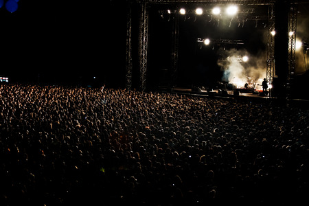 Thousands of People Crowd at night Rock Concertの写真素材