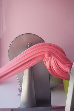 Taffy Machine with Pink Taffy Being Stretched
