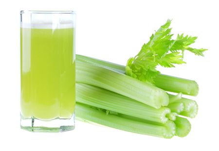 A glass of fresh celery juice isolated on white backgroundの写真素材