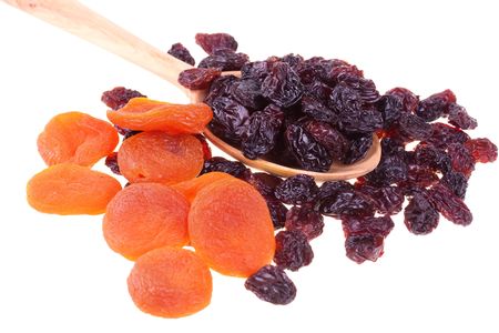 Dried fruits in a wood spoon isolated on white background
の写真素材
